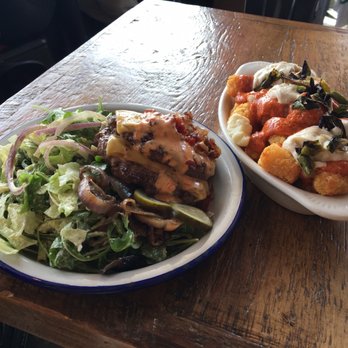 Lucky Buns - Brogan Bun with a double patty on greens with patatas bravas - Burgers Near Me - Washington, DC, District of Columbia