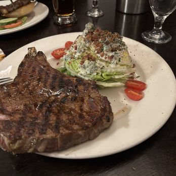 The CattleBaron Steakhouse & Bar - Cowboy Ribeye with wedge salad. - Steakhouses Near Me - Calgary, Alberta The CattleBaron Steakhouse & Bar - Cowboy Ribeye with wedge salad. - Steakhouses Near Me - Calgary, Alberta