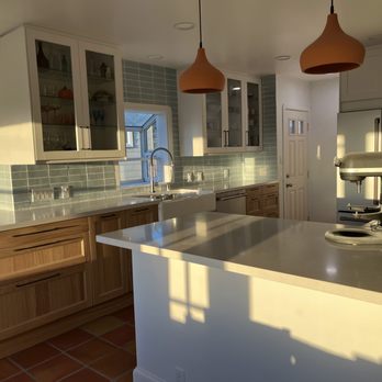 Sazo’s Construction - a kitchen with a large island - General Contractors Near Me - Oakland, California
