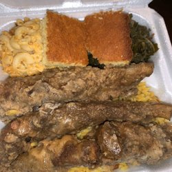M&M BBQ AND SOUL FOOD - Fried ribs with gravy over yellow rice