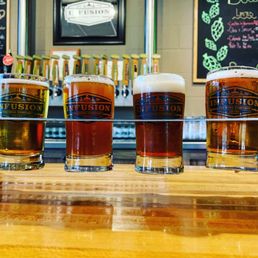 a flight of beers on a bar