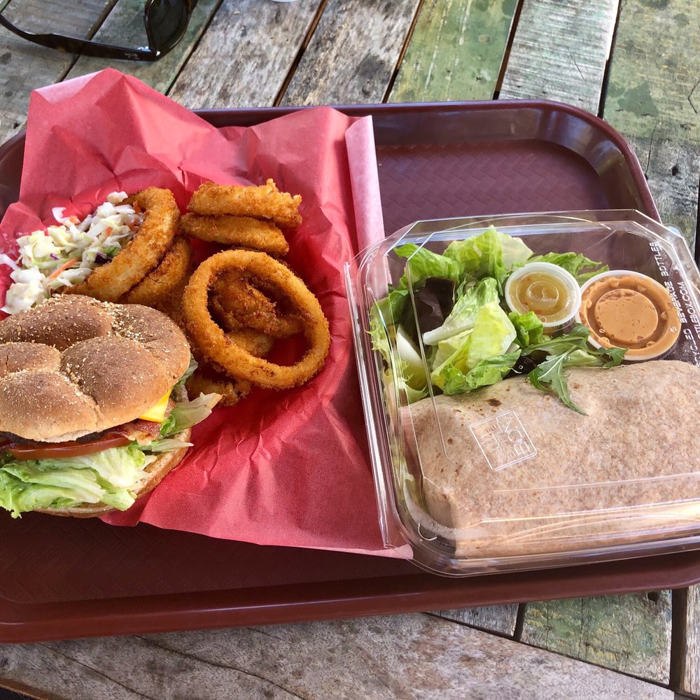 Oasis Deli - Left: Bacon Cheeseburger + Onion Rings Right: Vegetarian Wrap (note: comes with the salad) - Delis Near Me - Escondido, California