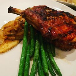Kurobuta pork chop in a honey-smoked paprika glaze, buttered green beans, shingled potatoes with pepperonata