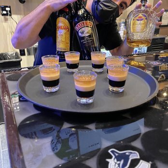 Lord Stanley's - a bartender pouring shots of liquor - Sports Bars Near Me - Spokane, Washington Lord Stanley's - a bartender pouring shots of liquor - Sports Bars Near Me - Spokane, Washington