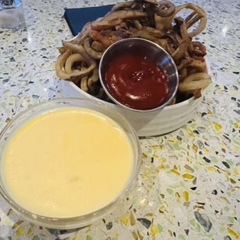 Sloane’s - Curly fries with taleggio cheese sauce - Cocktail Bars Near Me - Boston, Massachusetts