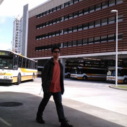 Alapai Transit Center - Woops, that guy got in the middle of the pic. The busses wait in the huge unloading area of the transit center in the shade.