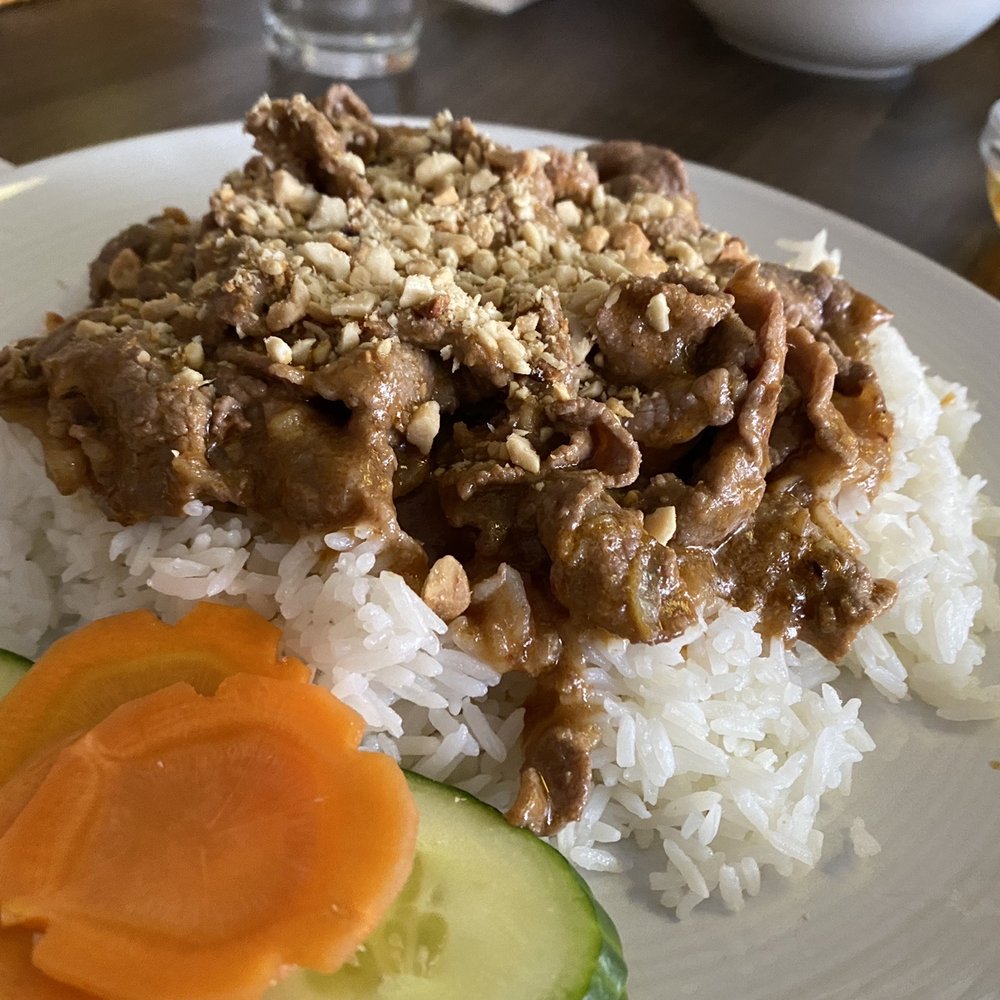 a plate of rice with meat and vegetables a plate of rice with meat and vegetables