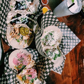 Tacovore - (Left to right) Carnitas, Fried Shrimp, Mole Verde, Carnivore and a coconut margarita. - Mexican Near Me - Eugene, Oregon