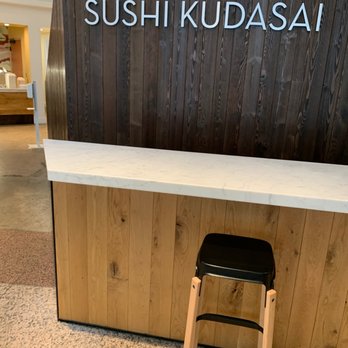 Sushi Kudasai - a counter with a stool - Sushi Bars Near Me - Seattle, Washington