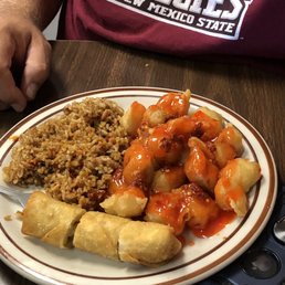 Sweet and sour pork, fried rice and egg roll. Sweet and sour pork, fried rice and egg roll.