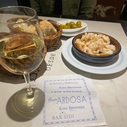 Sidi - Gambas al Ajillo, olives, bread, wine