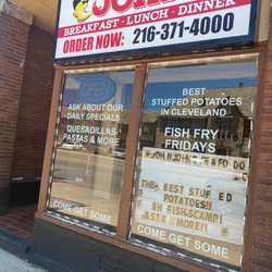 John John Seafood - Lights & open sign lit but no one appears to be here to accept business.