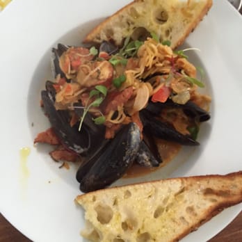 Pinch Kitchen - Rhode Island mussels with andouille sausage and homemade bread - New American Near Me - Miami, Florida Pinch Kitchen - Rhode Island mussels with andouille sausage and homemade bread - New American Near Me - Miami, Florida