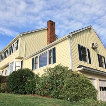 Bigelow Home Improvements - a yellow house - Roofing Near Me - Fall River, Massachusetts