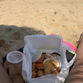 Pollard's Chicken - a woman's legs on the beach - Chicken Wings Near Me - Virginia Beach, Virginia Pollard's Chicken - a woman's legs on the beach - Chicken Wings Near Me - Virginia Beach, Virginia