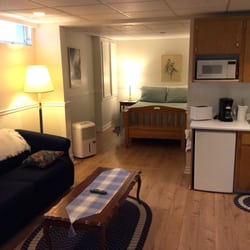 The Worn Doorstep - Living room area with kitchenette and large TV