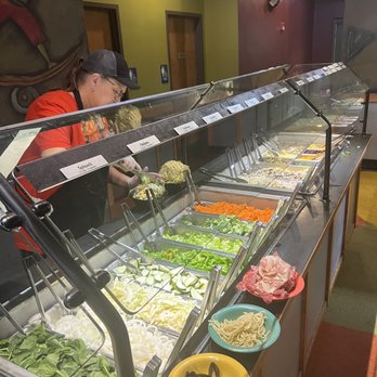 HuHot Mongolian Grill - a woman preparing food - Mongolian Near Me - Council Bluffs, Iowa HuHot Mongolian Grill - a woman preparing food - Mongolian Near Me - Council Bluffs, Iowa