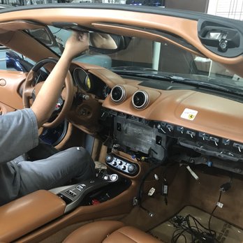 Custom Audio Designs - Installing the Bluetooth mic behind the mirror tucking the wires carefully - Car Stereo Installation Near Me - Walnut, California