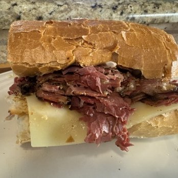 The PoBoy Shop - Smoked Pastrami piled high, onions and a slather of Cajun Mustard for a bold taste on a deli classic - Sandwiches Near Me - Dallas, Texas The PoBoy Shop - Smoked Pastrami piled high, onions and a slather of Cajun Mustard for a bold taste on a deli classic - Sandwiches Near Me - Dallas, Texas