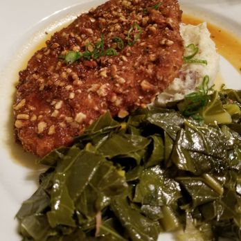 The Wild Olive - Pecan crusted pork with mashed potatoes and collard greens - Seafood Near Me - Crestview, Florida The Wild Olive - Pecan crusted pork with mashed potatoes and collard greens - Seafood Near Me - Crestview, Florida