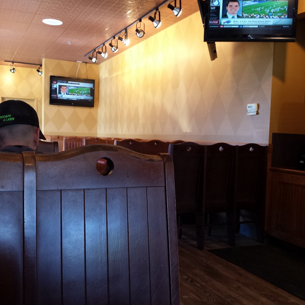 Rio Wraps - a man sitting in a booth watching tv - Tex-Mex Near Me - Bloomfield Hills, Michigan Rio Wraps - a man sitting in a booth watching tv - Tex-Mex Near Me - Bloomfield Hills, Michigan
