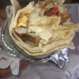 Breakfast burrito w/sausage & bacon added Breakfast burrito w/sausage & bacon added