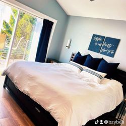 Lake Como Love Shack - Main bedroom king bed with luxurious bedding and 9 pillows room has attached bath with deck overlooking the lake.