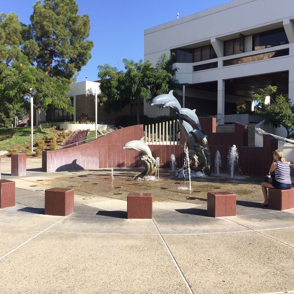 Cerritos Library - Splash pad (there's a kid playing behind the dolphins) 9/8/19 - Libraries Near Me - Cerritos, California Cerritos Library - Splash pad (there's a kid playing behind the dolphins) 9/8/19 - Libraries Near Me - Cerritos, California