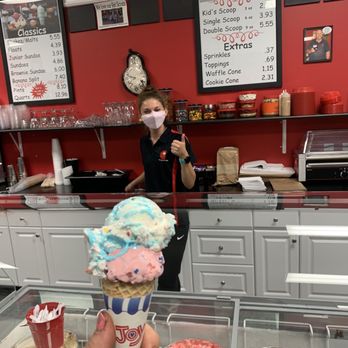 The Ice Cream Stop - a person holding a cone of ice cream - Ice Cream & Frozen Yogurt Near Me - Pooler, Georgia The Ice Cream Stop - a person holding a cone of ice cream - Ice Cream & Frozen Yogurt Near Me - Pooler, Georgia