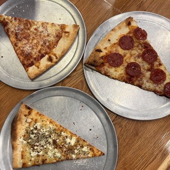 Black Cat Pizzeria - Cheese slice, white slice, and pepperoni slice. - Pizza Near Me - Yulee, Florida