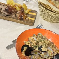 Trattoria Cavour - Suckling Pig and Fregula Al Frutti de Mare (Sardinian couscous seafood)
