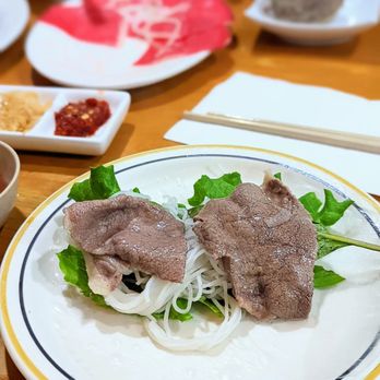 Song Huong Vietnamese - a plate of food on a table - Vietnamese Near Me - Vancouver, British Columbia Song Huong Vietnamese - a plate of food on a table - Vietnamese Near Me - Vancouver, British Columbia