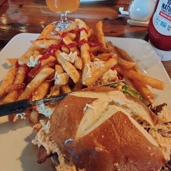 Eli Fish Brewing Company - Pretzel roll burger with hot chicken dip and fries. - Breweries Near Me - Batavia, New York