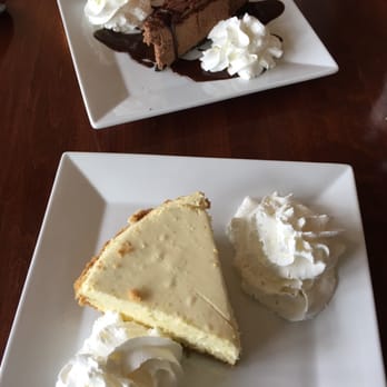 Eastside Grill - Foreground is Keylime pie with graham cracker crust and background is chocolate cheesecake with fudge sauce. - Steakhouses Near Me - Northampton, Massachusetts Eastside Grill - Foreground is Keylime pie with graham cracker crust and background is chocolate cheesecake with fudge sauce. - Steakhouses Near Me - Northampton, Massachusetts