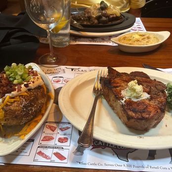 Texas Cattle Company - Pork chop with baked potato - Steakhouses Near Me - Lakeland, Florida Texas Cattle Company - Pork chop with baked potato - Steakhouses Near Me - Lakeland, Florida