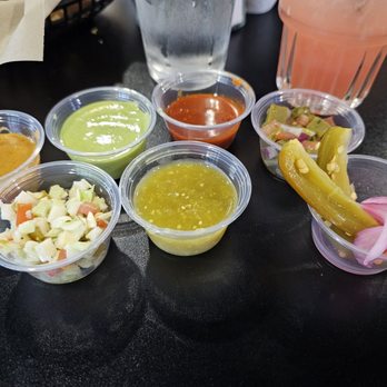 Don Titos Bar & Grill - Salsas from salsa bar. Most are pretty spicy - Tacos Near Me - Denair, California
