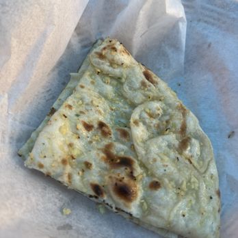 Himalaya Sono - Garlic Naan minus the two pieces we already had on our plate - Indian Near Me - Norwalk, Connecticut Himalaya Sono - Garlic Naan minus the two pieces we already had on our plate - Indian Near Me - Norwalk, Connecticut