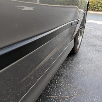 West Coast Dents - Start of the dent in the lower left corner, going towards the front wheel. The whole panel is pushed in - look at the black trim. - Mobile Dent Repair Near Me West Coast Dents - Start of the dent in the lower left corner, going towards the front wheel. The whole panel is pushed in - look at the black trim. - Mobile Dent Repair Near Me