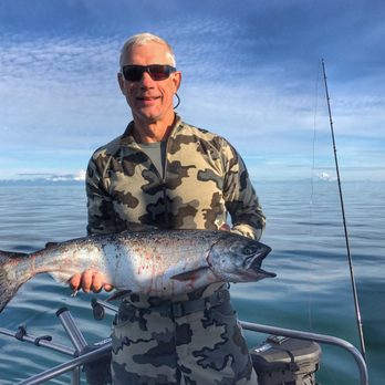 Manns Charter Service - Peter and his beauty of a king! Look at the perfect water!!! - Fishing Near Me Manns Charter Service - Peter and his beauty of a king! Look at the perfect water!!! - Fishing Near Me