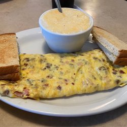 Wooden Spoon Diner - Meat lovers omelette with grits and toast
