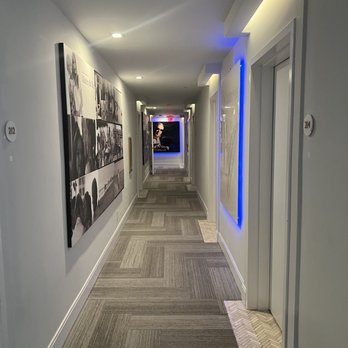The Cardozo Hotel - Bright well lit hallways covered in art - Hotels Near Me - Miami Beach, Florida The Cardozo Hotel - Bright well lit hallways covered in art - Hotels Near Me - Miami Beach, Florida