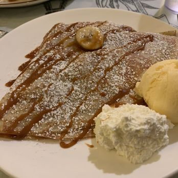 Crepes de Paris - "Warm Wish" Crepe - caramelized bananas in brown sugar rum, w/Chantilly cream, served with French vanilla ice cream. - Breakfast & Brunch Near Me - Pasadena, California Crepes de Paris - "Warm Wish" Crepe - caramelized bananas in brown sugar rum, w/Chantilly cream, served with French vanilla ice cream. - Breakfast & Brunch Near Me - Pasadena, California