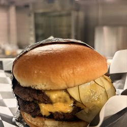 The Atley - A customer favorite! The Atley Smashburger with American cheese, shaved white onion, sliced pickle, dukes mayo, and yellow mustard.