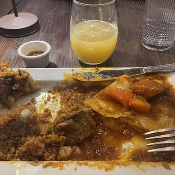 Azara Kitchen - Lamb and Jollof rice. It was delicious but I forgot to take a picture before I started. - African Near Me - New York, New York