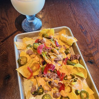 Cousins Pit Barbeque - Happy Hour Brisket nachos and Happy Hour Frozen Cousins Margarita, 8 oz (12.25% ABV) - Barbeque Near Me - Crowley, Texas