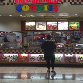 Great American Cookies - a man standing in front of a display of cookies - Bakeries Near Me - Cleveland, Tennessee Great American Cookies - a man standing in front of a display of cookies - Bakeries Near Me - Cleveland, Tennessee