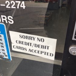 Lujan's Barber Shop - No cards.