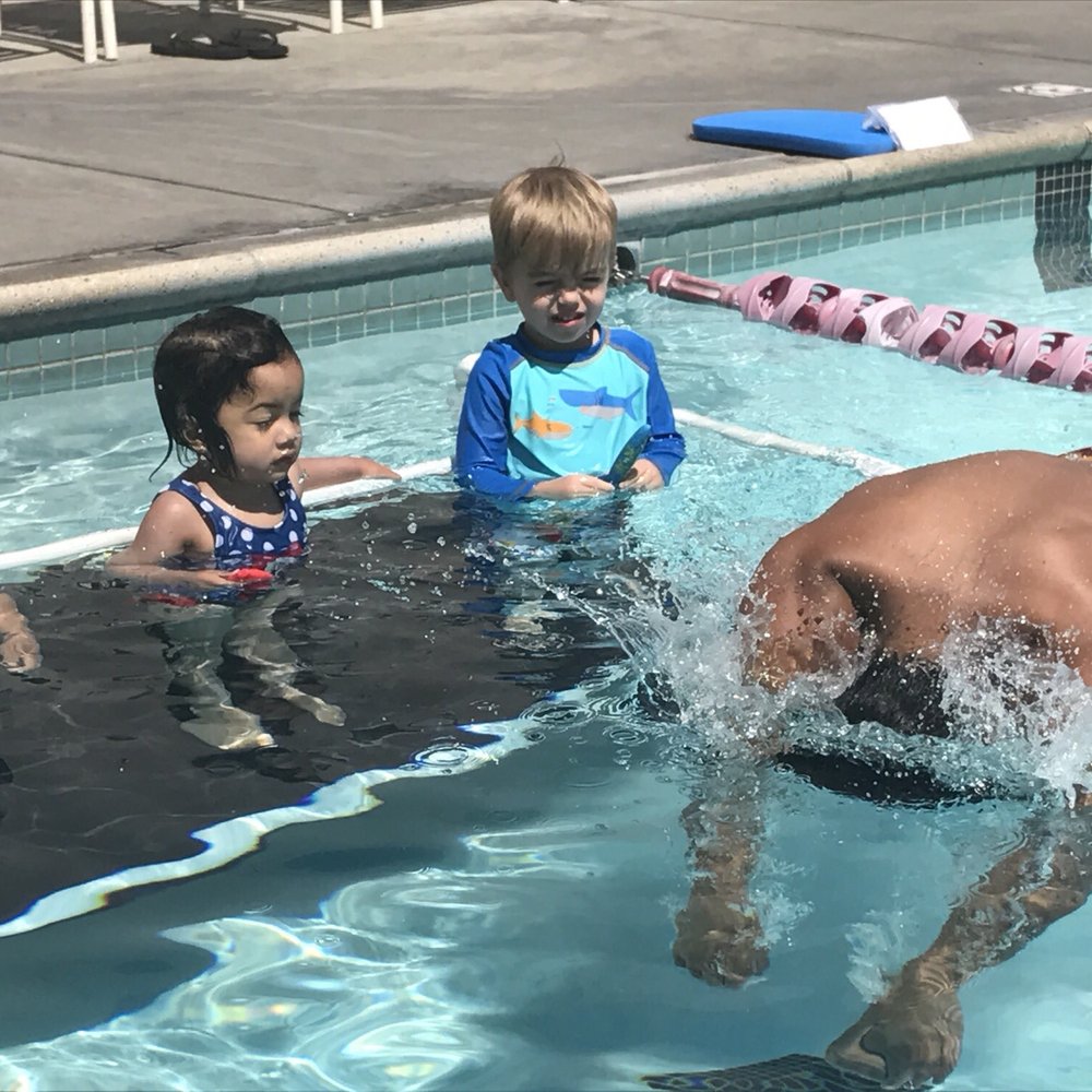 Alpert JCC - Instructor is teaching them how to swim underwater and retrieve toys. - Gyms Near Me - Long Beach, California