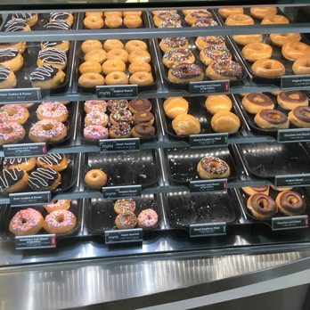 Krispy Kreme - a variety of donuts in a display case - Coffee & Tea Near Me - Allen Park, Michigan