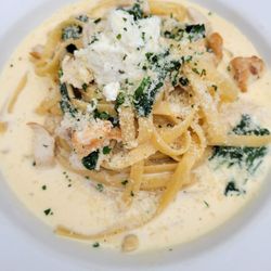 Chicken with spinach ricotta in garlic sauce.